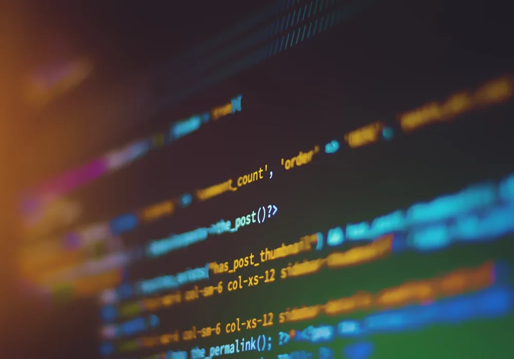 Source code on a screen, shown at an angle in shallow focus
